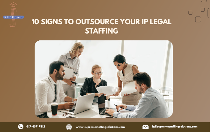 Group of 5 people discuss in IP Legal Staffing office.